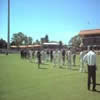 Players getting ready at the start of the day for the national anthem