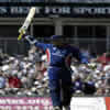 Marcus Tresocthick celebrating after reaching his milestone