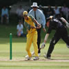 Haidee Tiffen slides her bat to get home while Lisa Sthalaker collects the ball