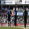 Andrew Flintoff and Vikram Solanki chat at the end of the over