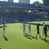 Jason Gillespie, Darren Lehmann and Shane Warne clapping Michael Kasprowicz off the ground